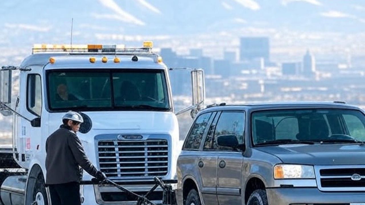 Salt Lake Jump Starts service truck assisting dead battery on snowy I-15
